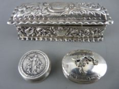 AN EMBOSSED SILVER RECTANGULAR BOX, Birmingham 1899 and two small pill boxes stamped 925 and 800, 73