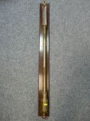 A VICTORIAN BRASS MARINE BAROMETER WITH THERMOMETER, mounted on a mahogany board, indistinct maker's