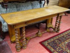 A VICTORIAN OAK ALTAR TABLE on twist front supports and turned cross stretcher on bun feet (one