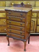 AN EDWARDIAN MAHOGANY SIX DRAWER MUSIC SHEET CABINET and contents, 106.5 cms high, 52 cms wide, 36.5