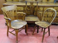 A VINTAGE OAK ELBOW CHAIR, an antique oak farmhouse chair and one other, various measurements