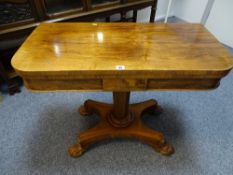 A VICTORIAN ROSEWOOD FOLDOVER CARD TABLE on segmented column and quatrefoil base with substantial