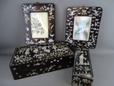 TWO ORIENTAL MOTHER OF PEARL INLAID & LACQUER WORK BOXES and two hanging portrait frames, various