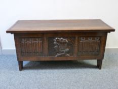 AN EXCELLENT REPRODUCTION OAK BLANKET CHEST with Adzed top on a joined oak box section base with