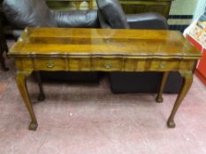 A GOOD REPRODUCTION WALNUT SERVING TABLE with foldover shaped top and three frieze drawers, on Queen