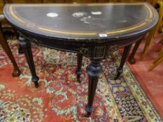 A VICTORIAN EBONIZED & AMBOYNA INLAID FOLDOVER CARD TABLE with lower gilt tracing, capped fluted
