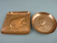 TWO NEWLYN ARTS & CRAFTS COPPER DISHES having embossed decorations of a fish in bubbles and an