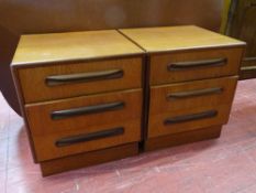 A PAIR OF G-PLAN TEAK THREE DRAWER BEDSIDE CHESTS, 52.5 cms high, 48 cms wide, 45 cms deep
