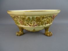 A ROYAL WORCESTER BLUSH IVORY & GILT DECORATED THREE FOOTED BOWL, 8.5 cms high, 17.5 cms diameter