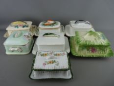 SEVEN VICTORIAN SARDINE DISHES, all having fish topped lids