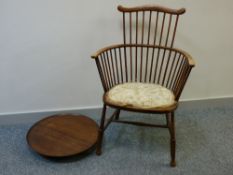 A VINTAGE STICKBACK ARMCHAIR with upholstered seat and a circular mahogany 'Lazy Susan', 48 cms