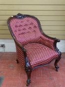 A GOOD VICTORIAN CARVED MAHOGANY SPOONBACK SALON ARMCHAIR, button back re-upholstered in classical