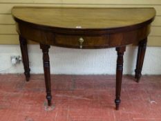 A LARGE 19th CENTURY MAHOGANY 'D' SHAPED FOLDOVER TEA TABLE with single frieze drawer on six