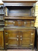 A WELL COLOURED OAK TRIDARN of peg-joined construction with brass butterfly hinges, the canopied top