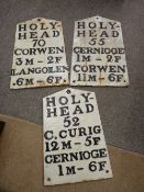 LOT WITHDRAWN AN EXCELLENT GROUP OF THREE CAST IRON ROAD SIGNS - 'Holyhead 70, 'Corwen 3 Miles, 2