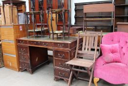 A reproduction mahogany desk together with a filing cabinet, a pair of folding chairs,