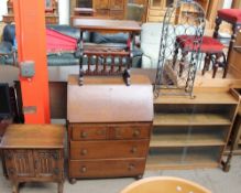 An oak side cabinet together with an oak bureau, magazine rack, bookcase,