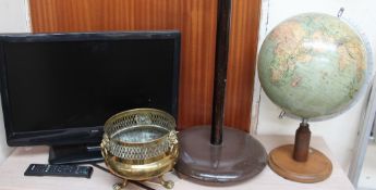 A Bush flat screen television (Sold as seen, untested) together with a standard lamp,