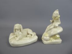 A Mid-20th Century Belleek figurine depicting a resting dog bearing the back stamp for period 1946-