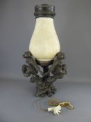 A Table Lamp in the form of three brass monkeys sat on branches holding hands and supporting a