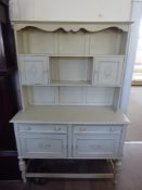 A Vintage Cream Painted French Cottage Dresser, with plate rack and two spice cupboards, two drawers