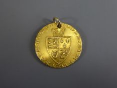 A 1798 Spade Guinea with 9ct suspension loop, approx 8.4 gms, in good condition.