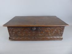 A Circa 18th Century Oak Bible Box; the box carved with the letters A W to top with carved front