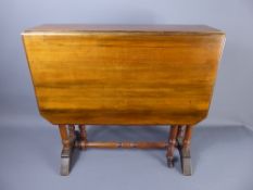 A Mahogany Sutherland Table, raised on turned legs and castors, approx 67 x 87 x 62 cms.