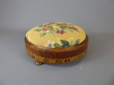 A Victorian Circular Fruitwood Foot Stool, with decorative inlay and tapestry top.