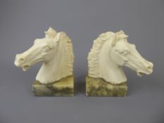 A Pair of Ceramic Italian Horse-head Book Ends on marble bases, approx 16 cms high.