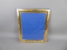 A Large Silver Plated Picture Frame.