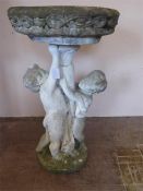 A Vintage Stone Bird Bath depicting Cherubs
