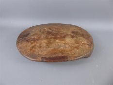 An Antique Hard Wood Cutting Board.