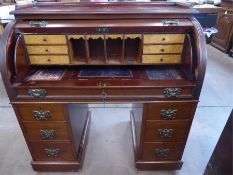 A Twin Pedestal Mahogany Roll Top Desk.
