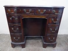 An Oak Serpentine Fronted Desk,