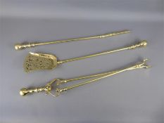 An Antique Brass Fire Irons.