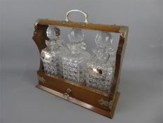 A n Oak Cased Cut Glass Tantulus