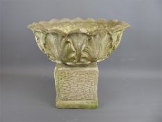 A Composite Stone Circular Planter.