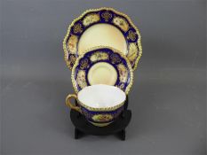 A Royal Worcester Cabinet Cup, Saucer and Plate