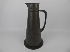 An Art Nouveau Tudric Pitcher.