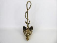 A Vintage Brass Door Stop.