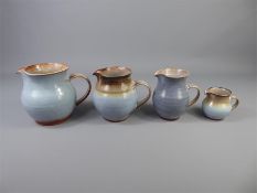 Four Campden Blue Slipware Glaze Jugs