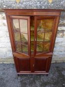 An Edwardian Mahogany Glazed Front Corner Display Cabinet