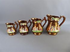 Four 19th Century Graduated Staffordshire Copper Lustre Ware Jugs