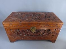 A Mid 20th Century Oriental Carved Camphor Wood Chest