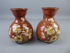 A Pair of Circa 1895 Doulton Lambeth Ware 'Michaelmas Daisy' Faience Ewers