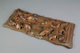 A Black Forest Carved Book Slide.