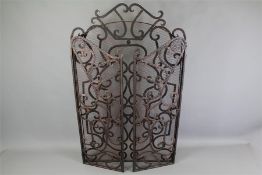 A Wrought Iron Fire Guard.