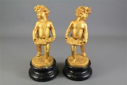 A Pair of Contemporary Italian Gilt Metal Garniture