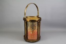 A Decorative Tri-Footed Metal Ice Bucket.